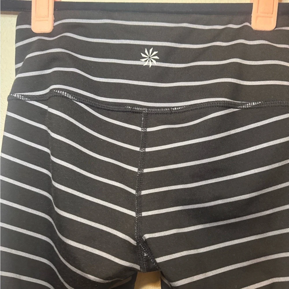 Athleta Chaturanga tight leggings in a black and gray striped pattern